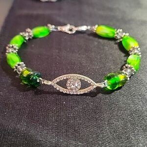 Handcrafted silver and glass beaded bracelet with all knowing eye